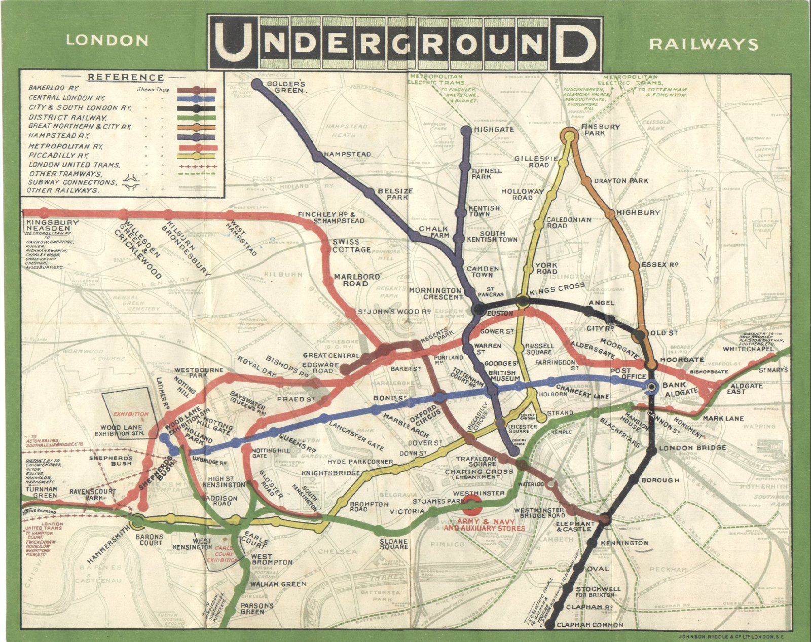 The London Underground map of 1908, its lines laid over a base map of streets and geography, with station names crowded at the centre.